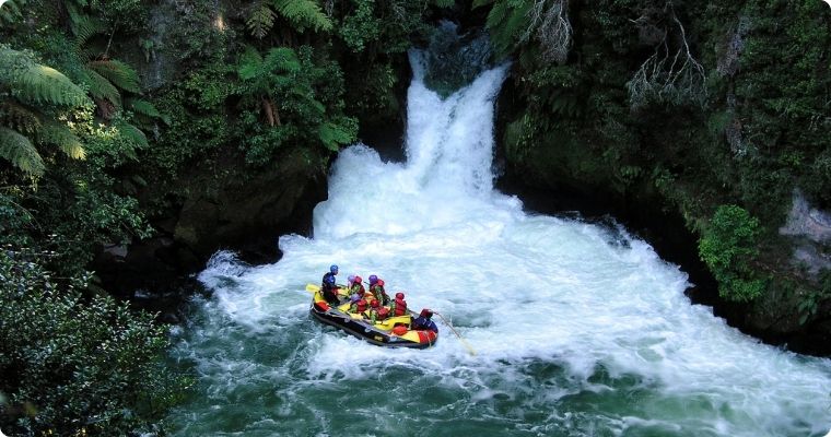 Group of people White water rafting down Kaituna River Rotorua 
